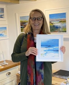 Lisa Timmerman collecting her new painting during Norfolk Open Studios