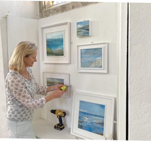Tracey Ross putting up an exhibition
